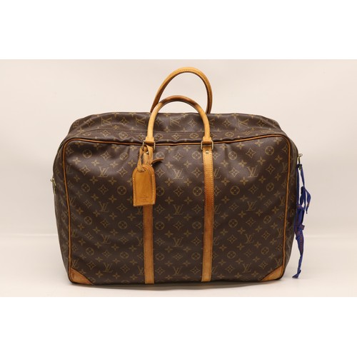 83 - WITHDRAWN - The Bobby Davro Collection: Louis Vuitton Sirius 50 soft sided suitcase, monogrammed can... 