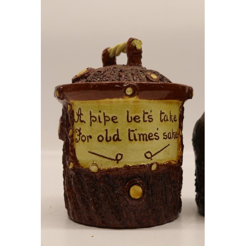 1016 - Pair of Leeds Fire Clay (L.F.C) barkware tobacco jars with lids, inscribed 'A pipe let's take for ol... 