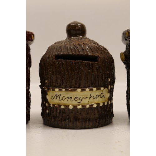 1016 - Pair of Leeds Fire Clay (L.F.C) barkware tobacco jars with lids, inscribed 'A pipe let's take for ol... 