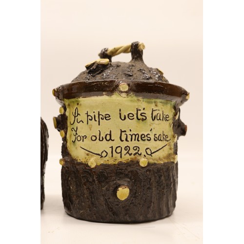 1016 - Pair of Leeds Fire Clay (L.F.C) barkware tobacco jars with lids, inscribed 'A pipe let's take for ol... 