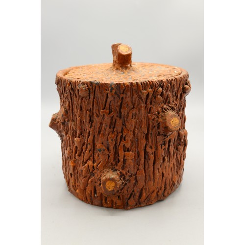 1015 - Barkware earthenware jar with matching lid, decorated with a cut branch motif on the body and formin... 