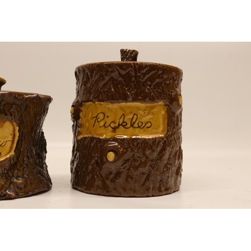1014 - Three earthenware jars; pair of straight sided jars with cut branch and bark texture surface, one in... 