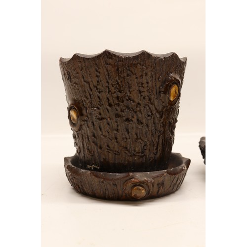1017 - A pair of earthenware plant pots with matching trays, designed in a barkware style. Each pot feature... 