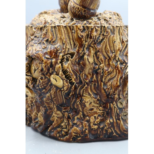 1010 - Earthenware tobacco jar with barkware slip decoration, featuring gnarly branch and bark effect detai... 