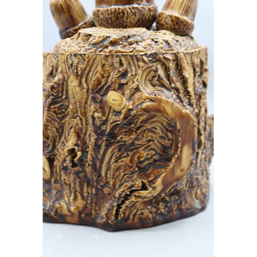 1010 - Earthenware tobacco jar with barkware slip decoration, featuring gnarly branch and bark effect detai... 