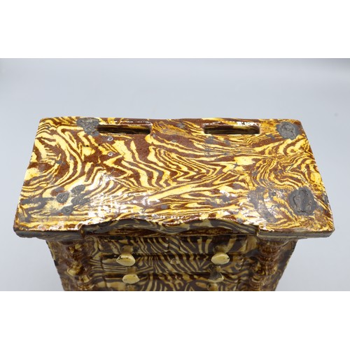 1021 - Agate ware miniature chest of drawers, dated 1874, likely Elland Halifax, slipware, H19cm
Bradley's ... 