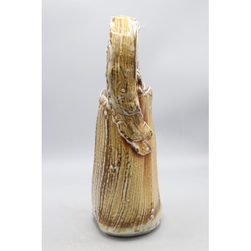1048 - Ruthanne Tudball (1948-) top handled basket vase, soap glaze, impressed mark to the base, H29.5cm
Br... 