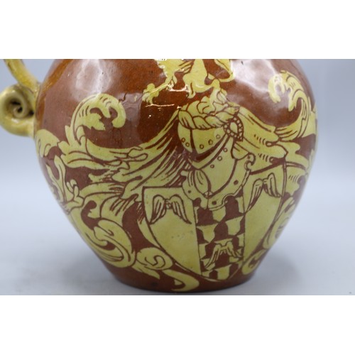 1060 - North Devon slipware harvest jug, scrolled handle, inscribed 'IN VERITATE TRIUMPHO', dated 1904, H24... 