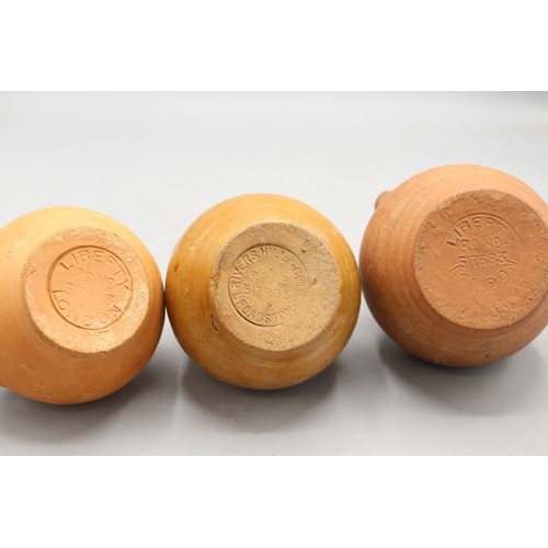 1069 - Two Verwood for Liberty, London, stoneware costrels, Liberty stamp to base, Rd No. 517683 and two ot... 