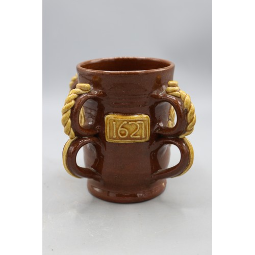 1064 - 19th century replica of a 17th century slipware Wrotham style four handled tyg, four double loop han... 