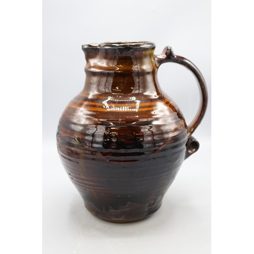 1059 - Charlotte Epton (1902-1970) for Leach Pottery jug, treacle drip glaze, swollen form, scroll detail t... 