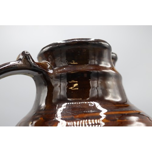 1059 - Charlotte Epton (1902-1970) for Leach Pottery jug, treacle drip glaze, swollen form, scroll detail t... 
