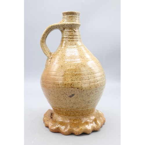 1049 - John Hudson stoneware single handled swollen cylindrical form vase on gadrooned base, H25cm
Bradley'... 