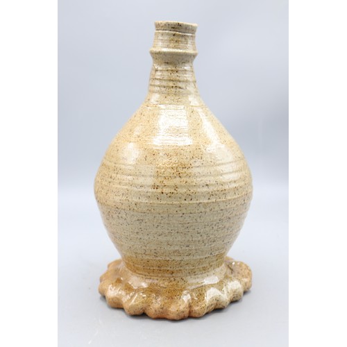 1049 - John Hudson stoneware single handled swollen cylindrical form vase on gadrooned base, H25cm
Bradley'... 