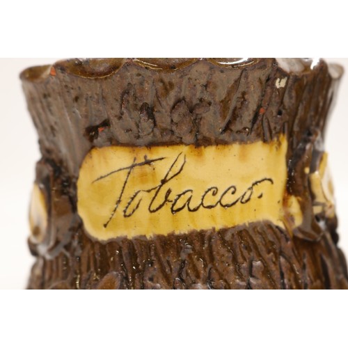 1018 - Barkware, slipware tobacco jar, bark effect with branch style handle, inscribed 'Tobacco', H12.5cm; ... 