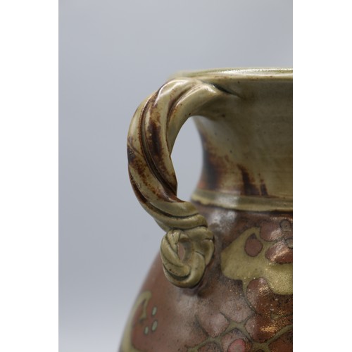 1085 - Paul Muchan (1948-) footed urn shaped vase, twin scroll handles, salt glazed, H21cm
Bradley's Shippi... 