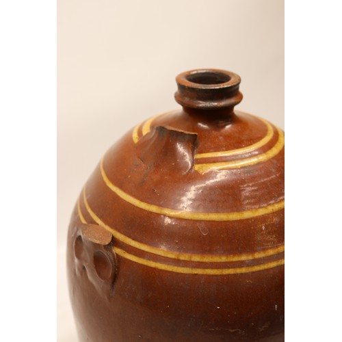 1039 - Slipware flagon, split salt glaze, striped detailing to top portion, cylindrical form, missing handl... 
