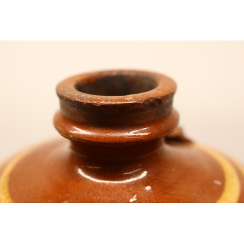 1039 - Slipware flagon, split salt glaze, striped detailing to top portion, cylindrical form, missing handl... 