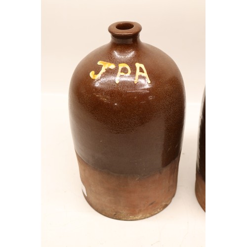 1041 - Two J.P. Appleby flagons, both with split treacle glaze, initialled 'JPA', H32cm max
Bradley's Shipp... 