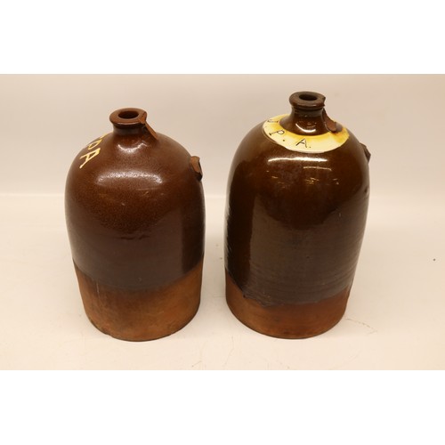 1041 - Two J.P. Appleby flagons, both with split treacle glaze, initialled 'JPA', H32cm max
Bradley's Shipp... 