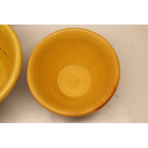 1032 - Two large slipware pancheons, salt glazed inner,  in the manner of Isaac Button, D45cm max
Bradley's... 