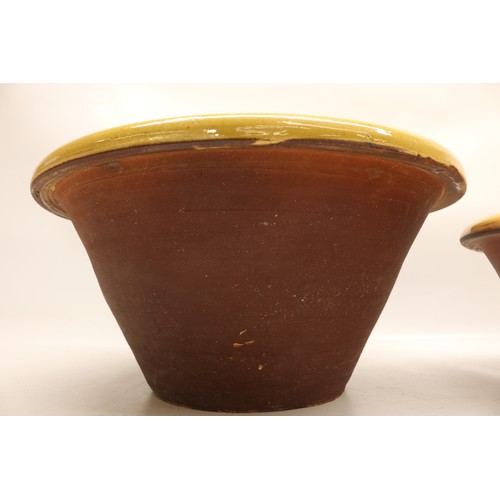 1032 - Two large slipware pancheons, salt glazed inner,  in the manner of Isaac Button, D45cm max
Bradley's... 