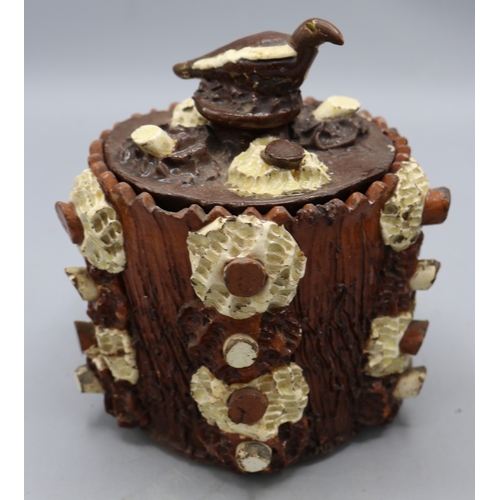 1012 - Barkware tobacco jar with alternate coloured appliques and bird finial, and a bark-ware money box, s... 