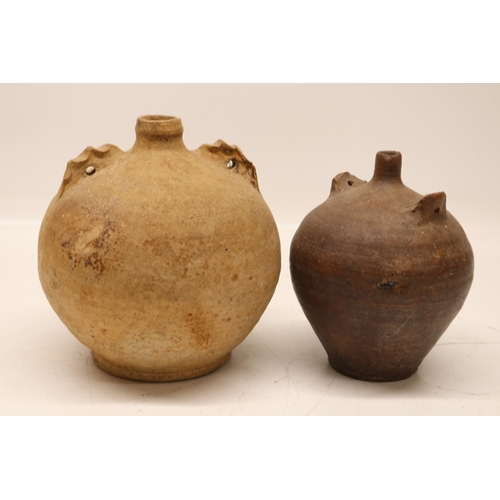 1071 - Two costrels/ Dorset owls, one in unusual clay with handles parallel to the neck, H20cm max
Bradley'... 