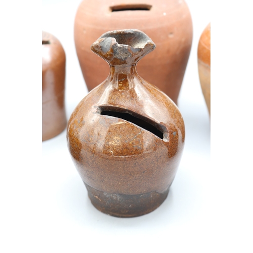 1035 - Slipware and Earthenware money boxes, incl. Early 19th Century slipware money box, globular form wit... 