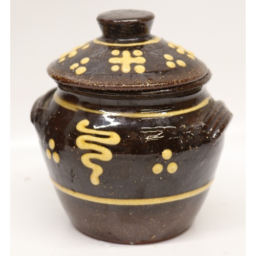 1057 - Slipware tobacco jar, twin handled, partially glazed, squiggle patterns, missing lid; slipware tray ... 