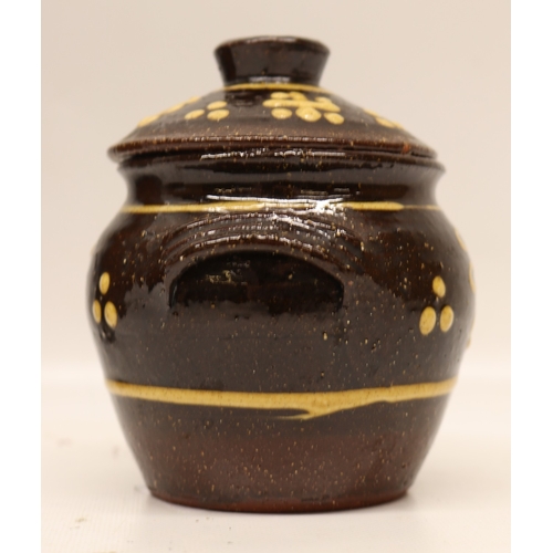1057 - Slipware tobacco jar, twin handled, partially glazed, squiggle patterns, missing lid; slipware tray ... 