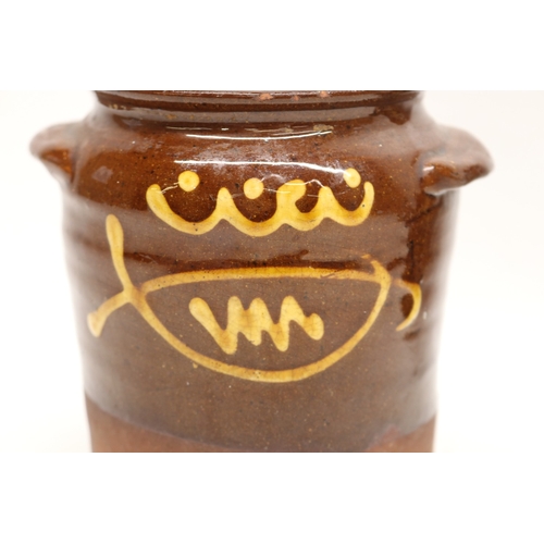 1057 - Slipware tobacco jar, twin handled, partially glazed, squiggle patterns, missing lid; slipware tray ... 