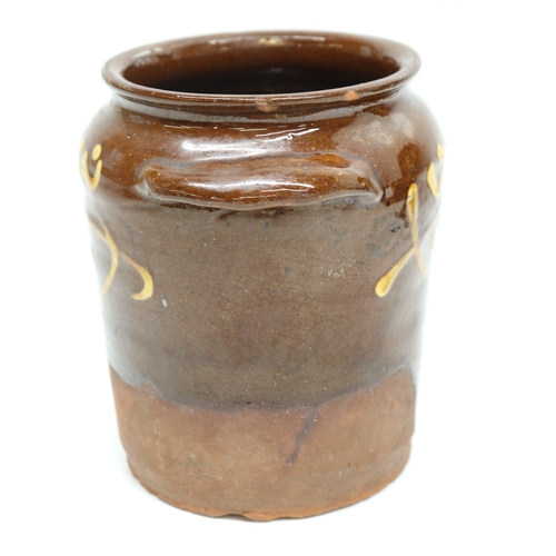 1057 - Slipware tobacco jar, twin handled, partially glazed, squiggle patterns, missing lid; slipware tray ... 