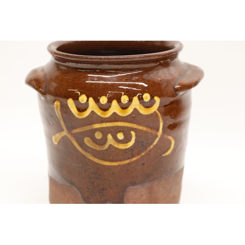 1057 - Slipware tobacco jar, twin handled, partially glazed, squiggle patterns, missing lid; slipware tray ... 