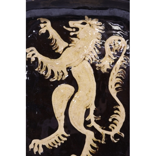1057 - Slipware tobacco jar, twin handled, partially glazed, squiggle patterns, missing lid; slipware tray ... 
