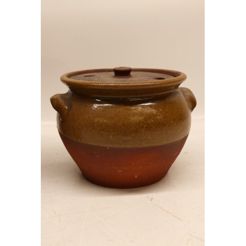1056 - Two Yorkshire slipware crocks or cooking pots, one cylindrical and the other squat baluster, both pa... 