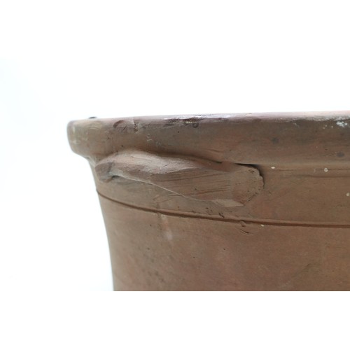 1067 - Large terracotta key hole shaped pot, glazed inner, two handles to each side, L63cm
Bradley's Shippi... 