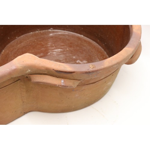 1067 - Large terracotta key hole shaped pot, glazed inner, two handles to each side, L63cm
Bradley's Shippi... 