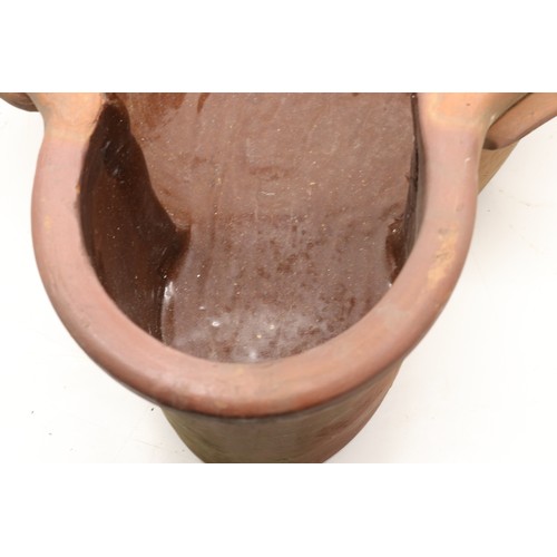 1067 - Large terracotta key hole shaped pot, glazed inner, two handles to each side, L63cm
Bradley's Shippi... 