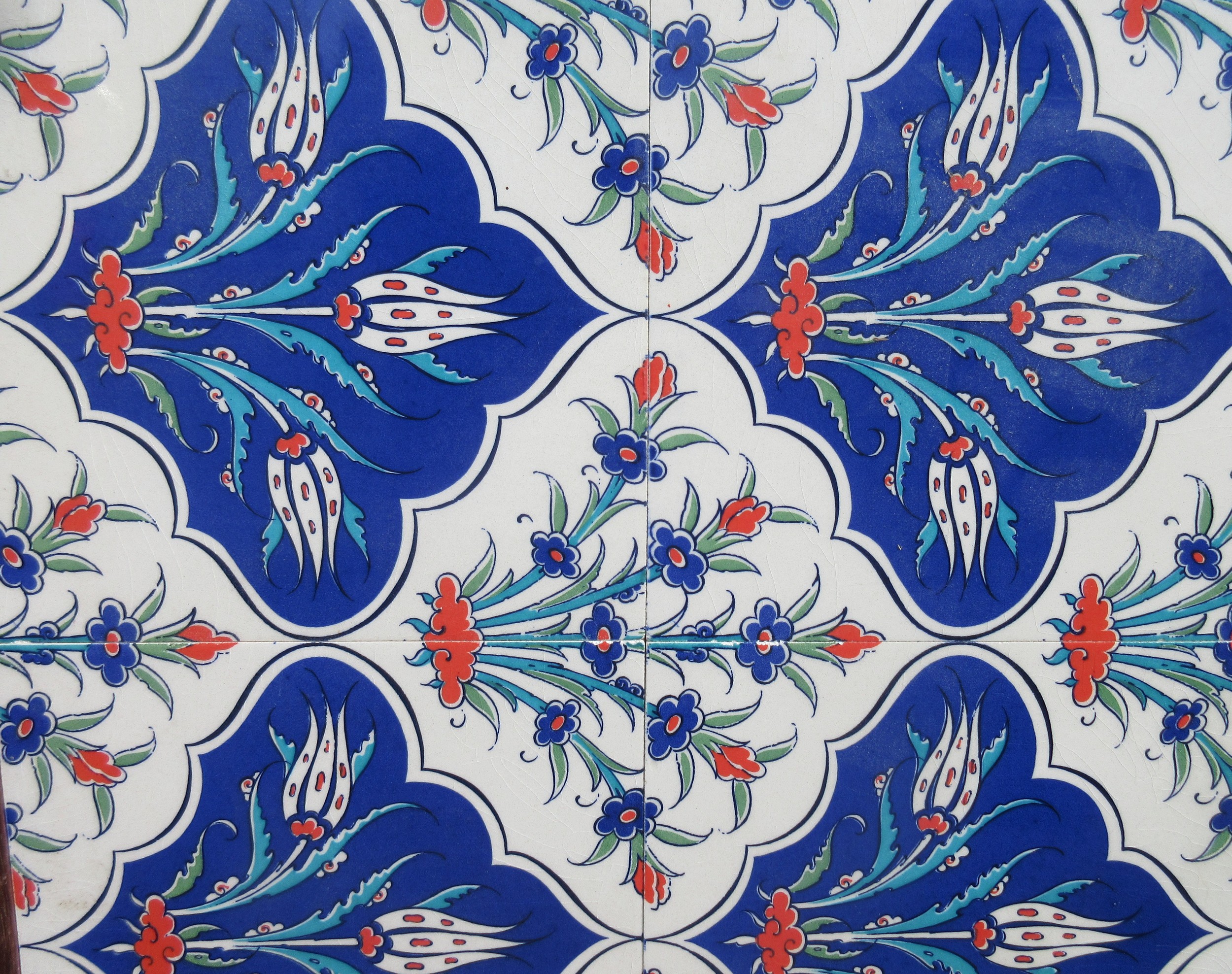 Two framed pieces of Isnic ceramics tiles, with repeating detail ...