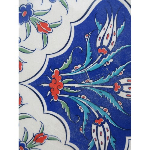 Two framed pieces of Isnic ceramics tiles, with repeating detail ...