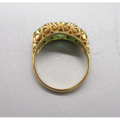6 - 18ct hallmarked emerald and diamond ring, comprising 3 emeralds and 4 small diamonds, size P (6.6g)
... 
