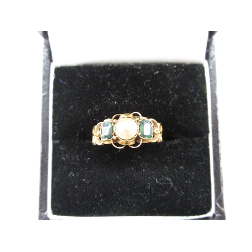 7 - Yellow metal 3 stone ring comprising 2 dark green stones and a pearl colour stone, size M 1/2 (1.3g)... 