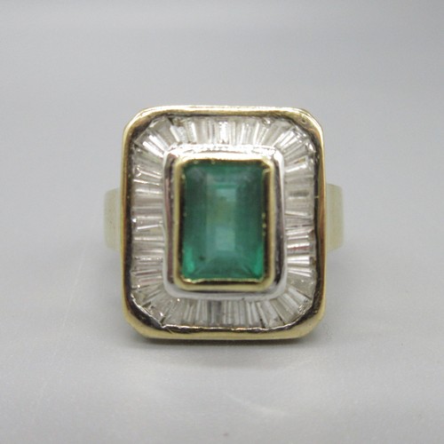 8 - 18ct yellow gold natural emerald and diamond cocktail ring, central baguette cut emerald in bezel se... 