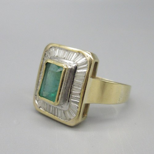 8 - 18ct yellow gold natural emerald and diamond cocktail ring, central baguette cut emerald in bezel se... 
