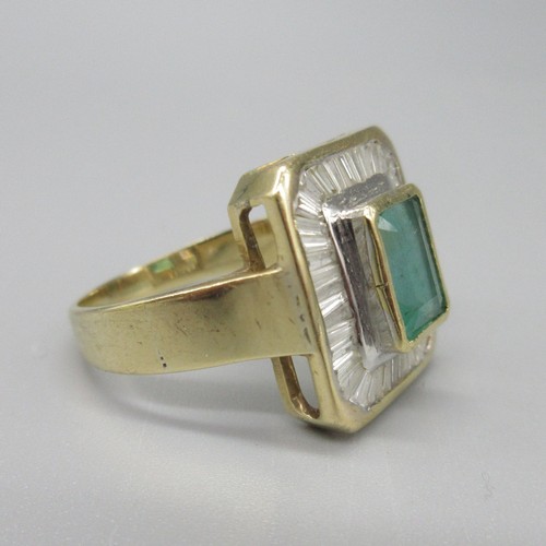 8 - 18ct yellow gold natural emerald and diamond cocktail ring, central baguette cut emerald in bezel se... 
