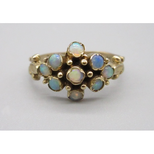 9 - Yellow metal 9 Opal stone cluster ring, Size I (2g)
Bradley's Shipping £20.00 plus vat (UK Only)