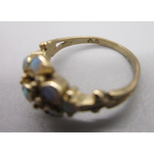 9 - Yellow metal 9 Opal stone cluster ring, Size I (2g)
Bradley's Shipping £20.00 plus vat (UK Only)
