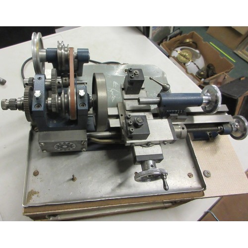 1436 - Cowells Clockmakers metalworking lathe with original electric motor and tabletop stand, loose clock ... 