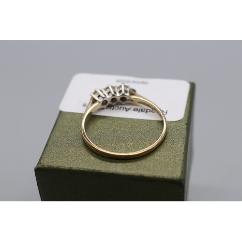 3 - 9ct stamped yellow gold trilogy ring, set with three round brilliant claw-set diamonds with an appro... 
